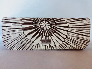 Ebony clutch featuring Fog Dreaming by Aboriginal artist Marita Sambono, Merrepen Arts