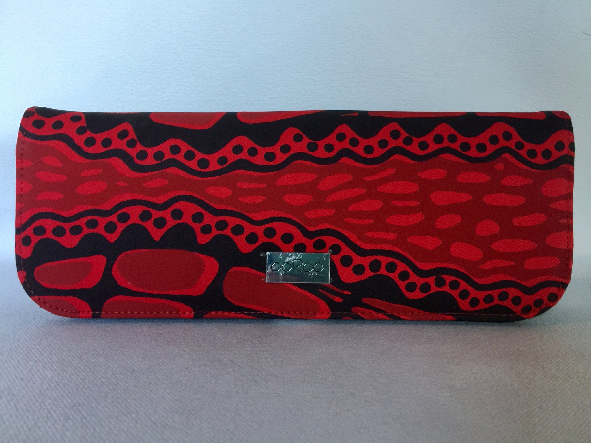 Ebony clutch  featuring crocodile by Aboriginal artist Aaron McTaggart, Merrepen Arts