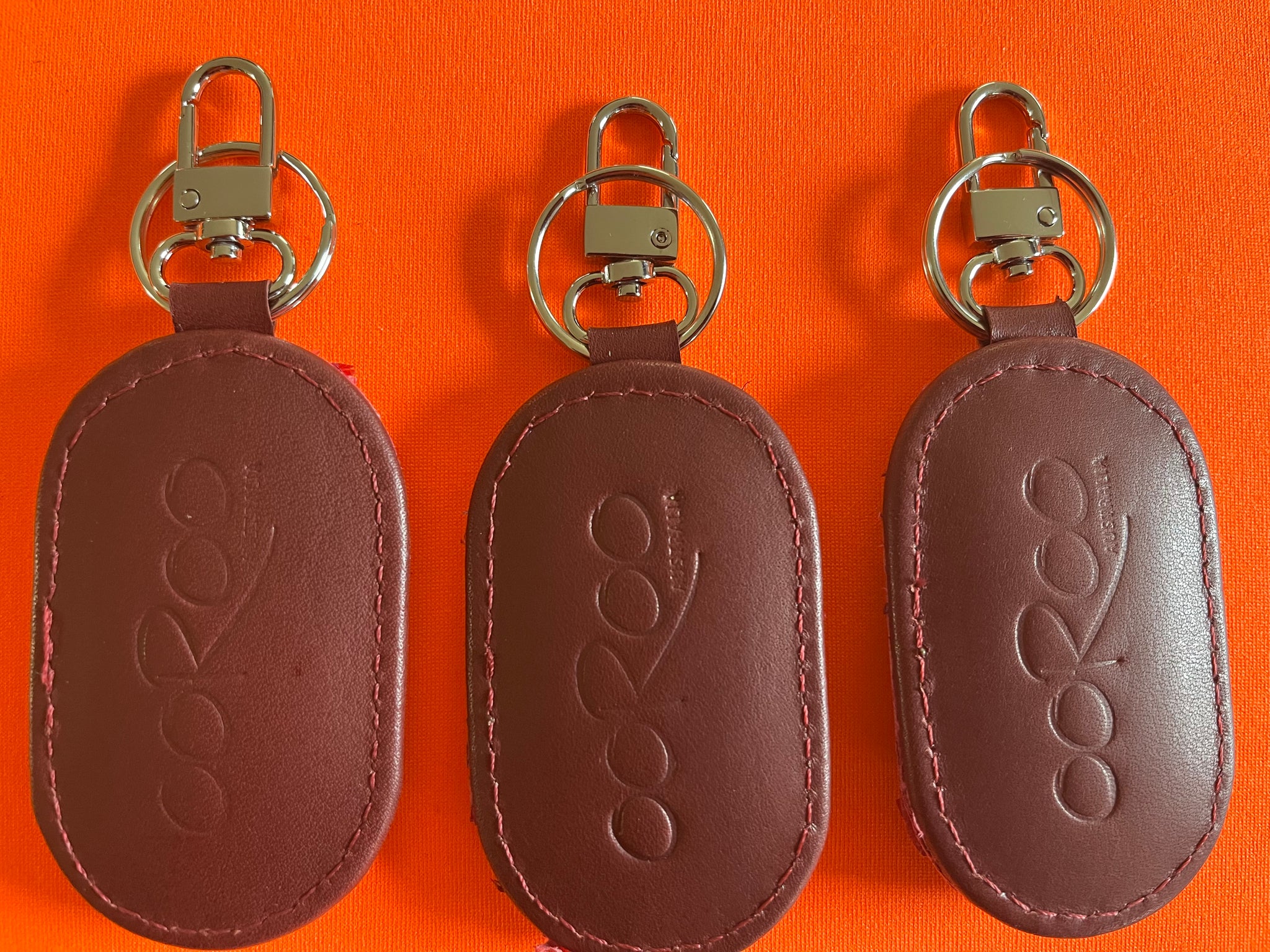 Key Fobs  featuring barramundi leather from the kimberly WA - Fuchsia Ruffled Deep Cherry Red leather.