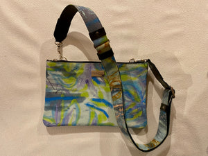 Zara crossbody bag featuring  Chaotic Collage  by artist Anna Reynolds.