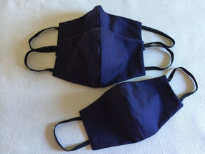 Face mask featuring navy linen with a black cotton reversable option .